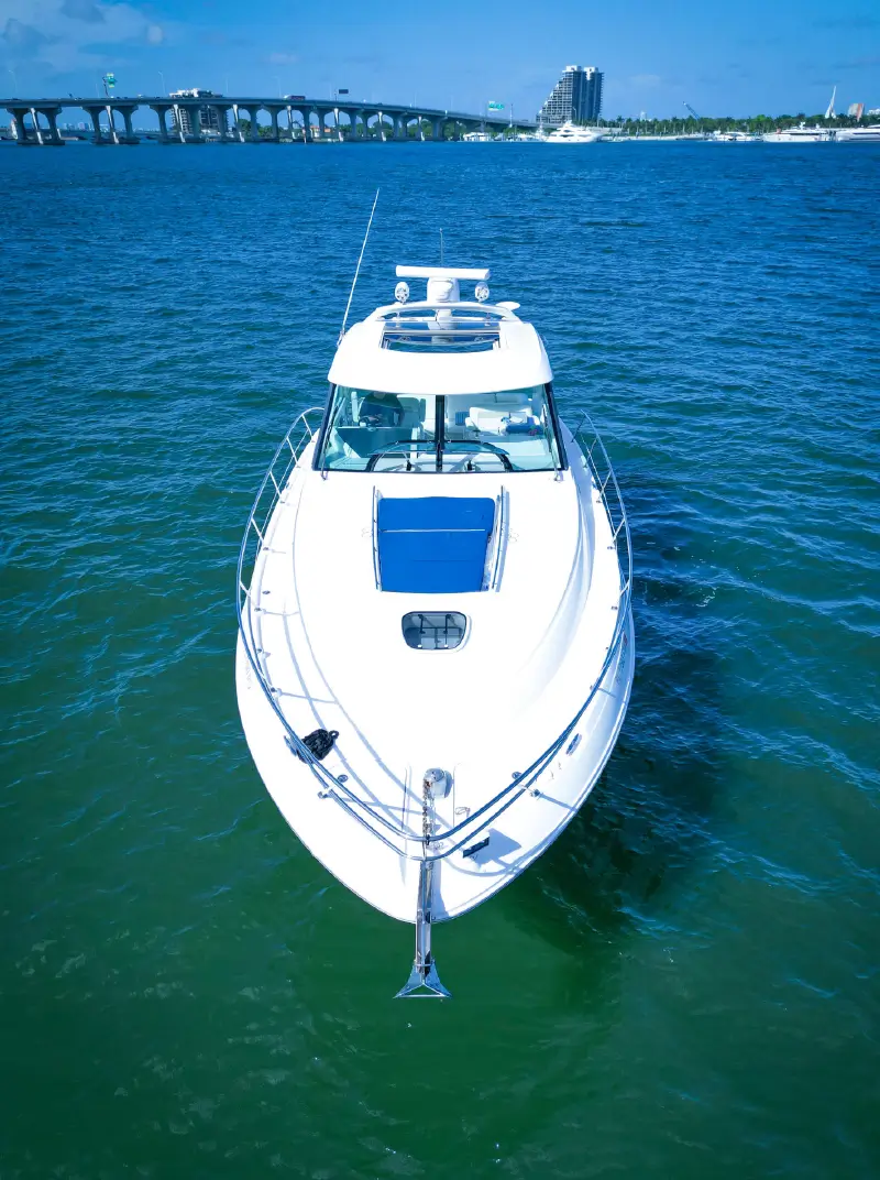 People relaxing on a 50ft Sea Ray yacht during a Miami cruise. 800x1072