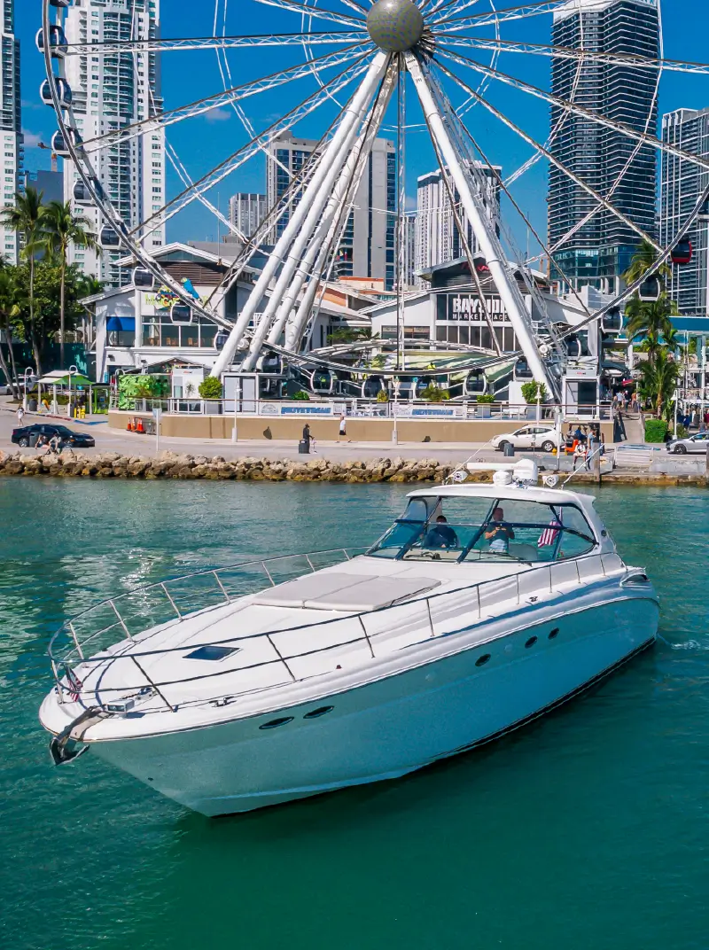 People enjoying a trip on a 55ft Sea Ray yacht in Miami. 800x1072